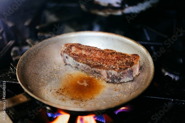 Fototapeta Chef cooking steak