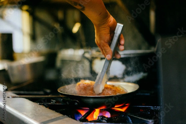 Fototapeta Chef cooking steak