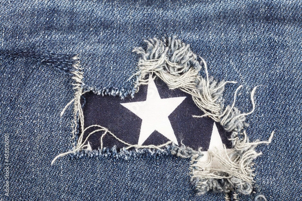 Obraz Blue torn denim jeans texture.