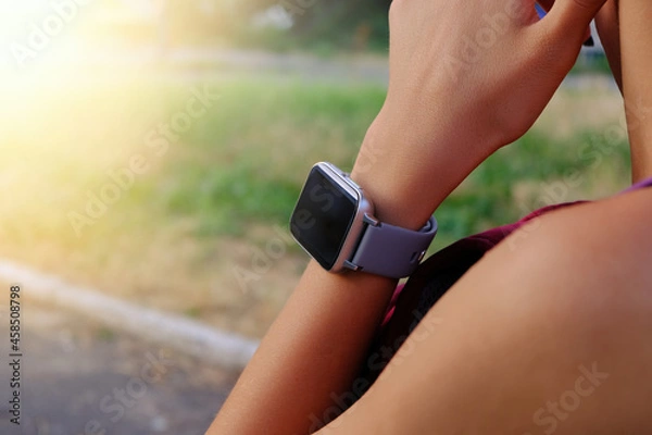 Obraz Close up smart watch on a woman hand.