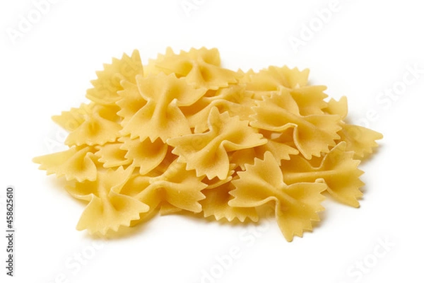 Fototapeta Heap of raw farfalle pasta isolated on white background