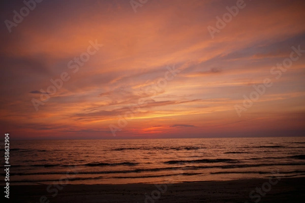 Fototapeta Clouds and sea after sunset.