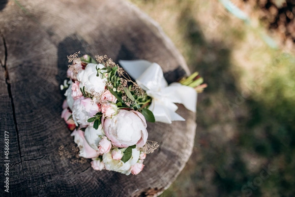 Fototapeta A wedding bouquet with pink and white peonies. The concept of a happy marriage.