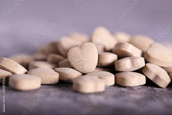 Fototapeta cat food in the shape of a heart is on the table