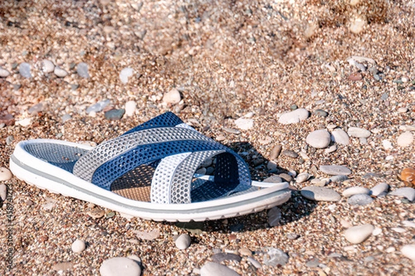 Fototapeta beach slipper on a sandy beach on a summer day