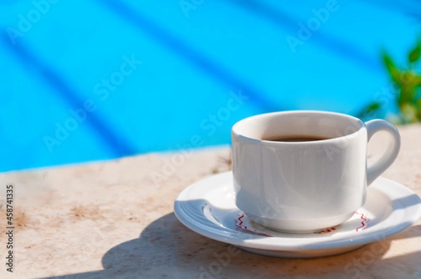 Fototapeta mug with coffee on a table in a cafe