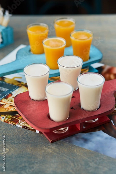 Obraz set of alcoholic sets on a wooden stand for the drinks menu of the restaurant or pub
