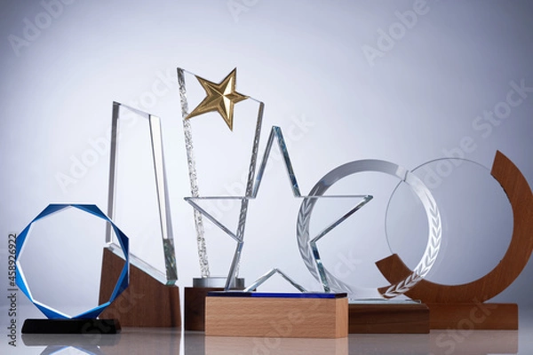 Fototapeta group of crystal trophy on gray  background