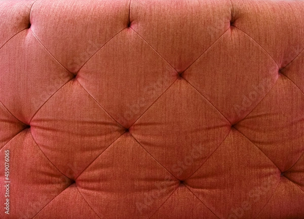 Fototapeta Close up of red fabric sofa. For using as background and pattern.