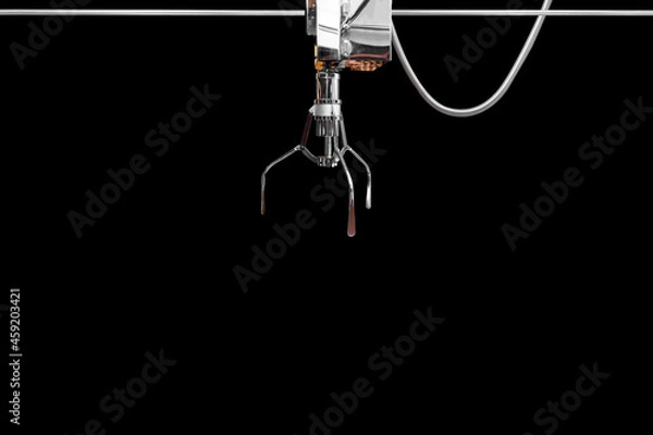 Obraz Claw game or cabinet game for catching the doll or a mechanical arm selecting soft toy in a vending machine isolated on black background with clipping path.