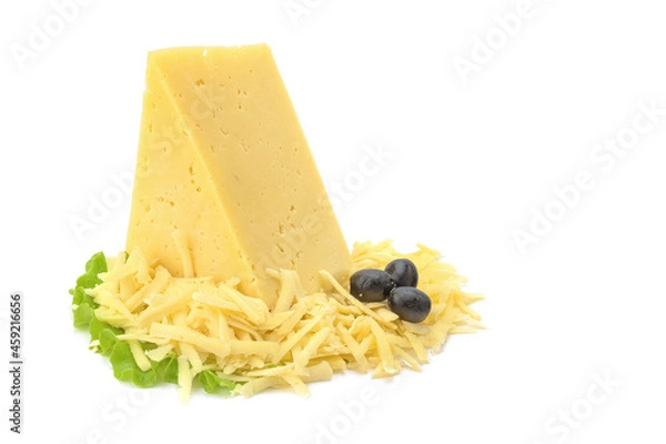 Fototapeta A piece of hard yellow cheese with olives in close-up, isolated on a white background.selective focus