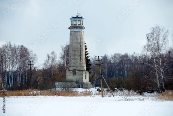 Fototapeta A view on a winter day at Big Volzhsky lighthouse on the river. Dubna city, Moscow region, Russia.