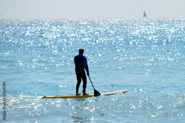 Fototapeta Full frame of surfer silhouette in the open sea 