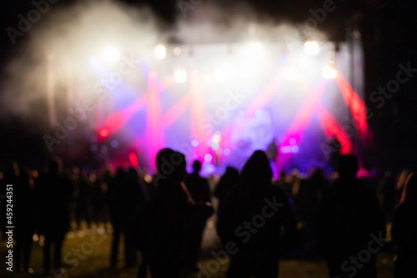 Obraz crowd at concert and silhouettes in stage lights