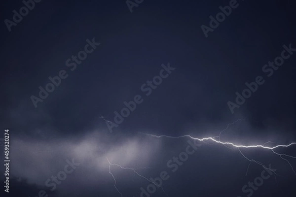 Fototapeta Lightning and thunder pictured during a rainstorm in deccan region of india monsoon season