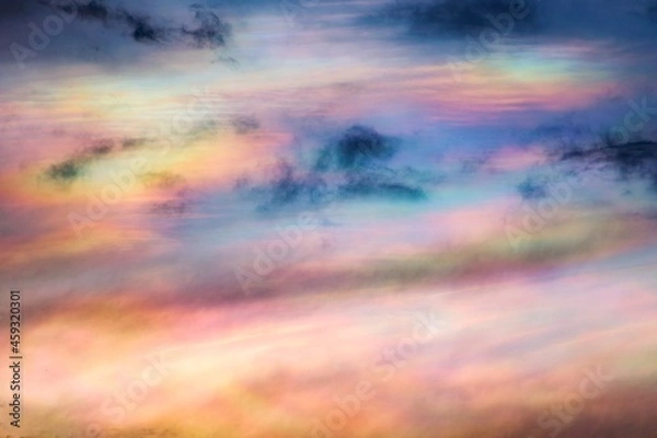 Fototapeta A rare case of Iridescent clouds showing dramatic color change in the sky
