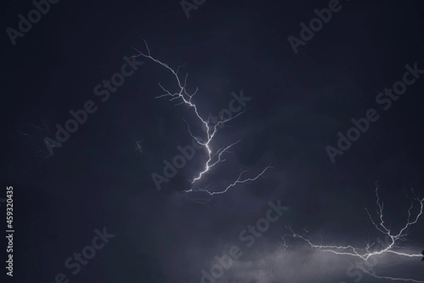 Fototapeta Lightning and thunder pictured during a rainstorm in deccan region of india monsoon season