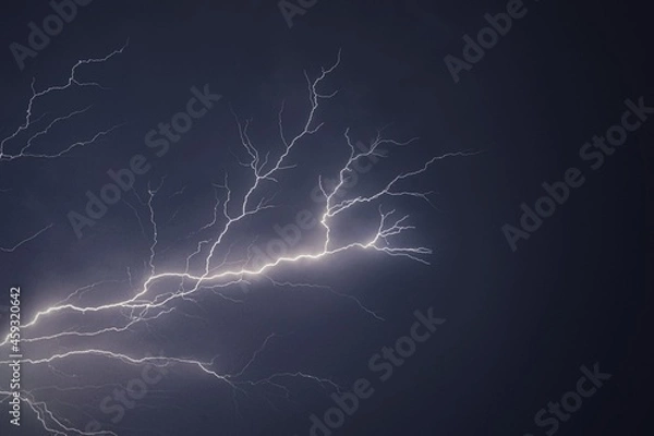 Fototapeta Lightning and thunder pictured during a rainstorm in deccan region of india monsoon season