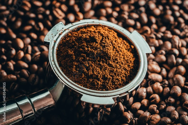 Obraz Portafilter on ton of coffee beans with black background
