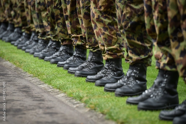 Obraz Swiss army soldiers representing the guard of honor are seen during a welcome ceremony in Bern