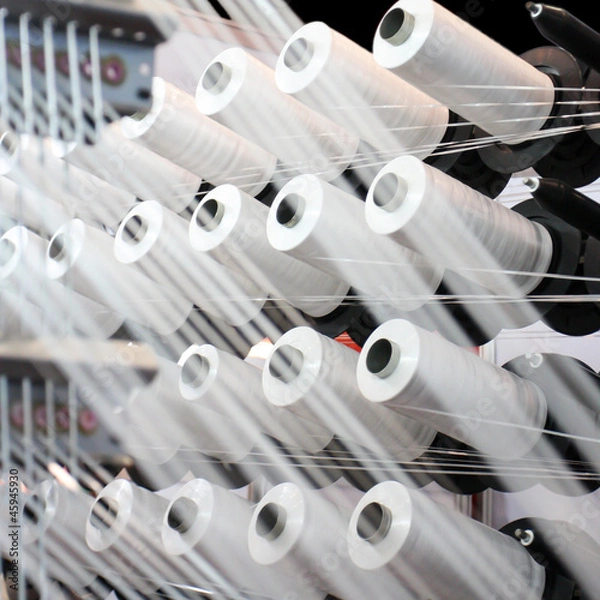 Fototapeta Zbliżenie nici dla przemysłu tekstylnego, tkania i wypaczania