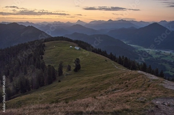 Fototapeta Scenic sunrise above a beautiful mountain range. Moutain range during sunrise.