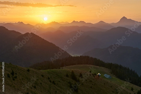 Fototapeta Scenic sunrise above a beautiful mountain range. Moutain range during sunrise.