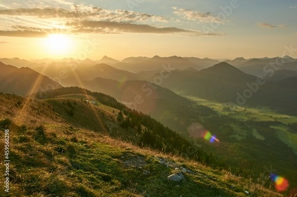 Fototapeta Scenic sunrise above a beautiful mountain range. Moutain range during sunrise.