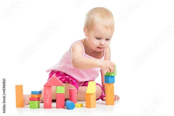 Fototapeta kid playing toy blocks  isolated on white background