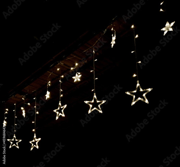 Fototapeta Decorative lights glowing in the dark 