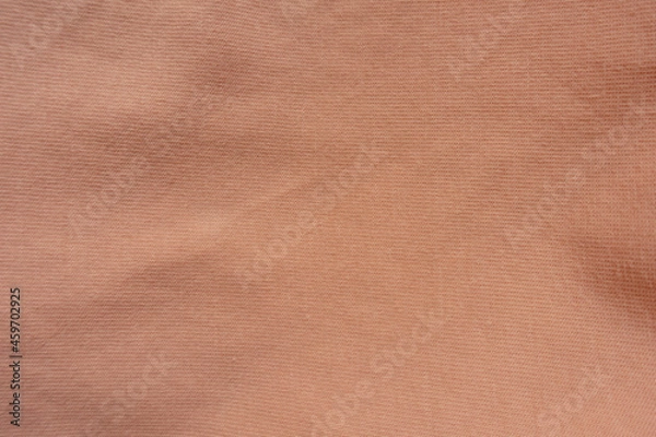 Fototapeta Texture of apricot colored simple cotton jersey fabric