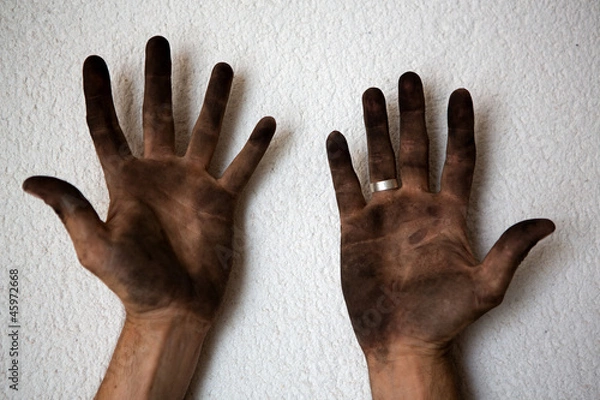 Fototapeta black dirty man hands open palms on white