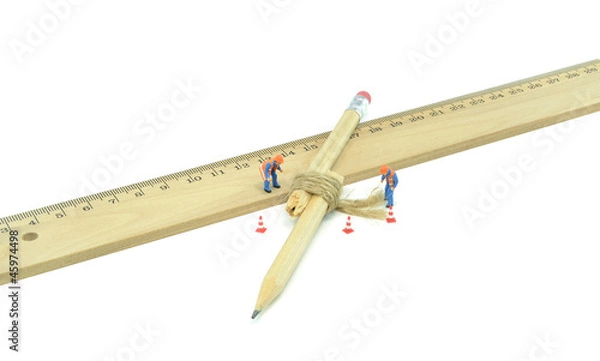 Obraz A broken pencil being repaired by workmen in recycling concept