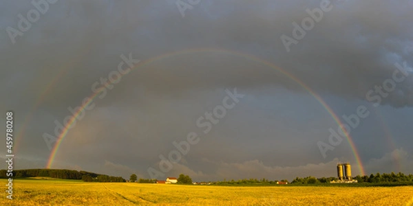 Obraz Double Rainbow during sunset over field