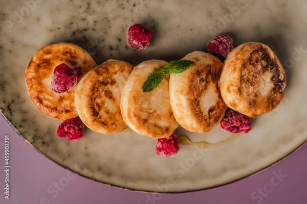 Obraz Healthy breakfast, cheese pancakes with raspberry and mint,  copy space