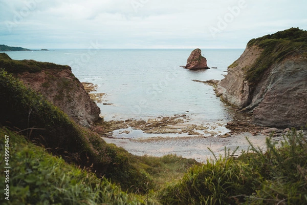 Fototapeta Wild hidden beach on the coast of Basque Country