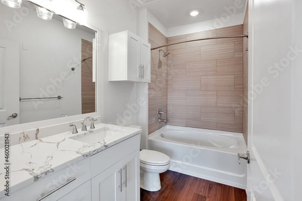 Fototapeta Bathroom with bathtub and shower in new luxury home with all glass shower. 