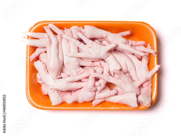 Obraz Chicken feet in the package. Meat semi-finished products. View from above