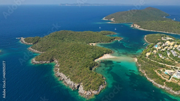 Fototapeta Aerial drone photo of limestone tropical exotic island bay with crystal clear turquoise sea visited by yachts and sail boats in popular paradise destination