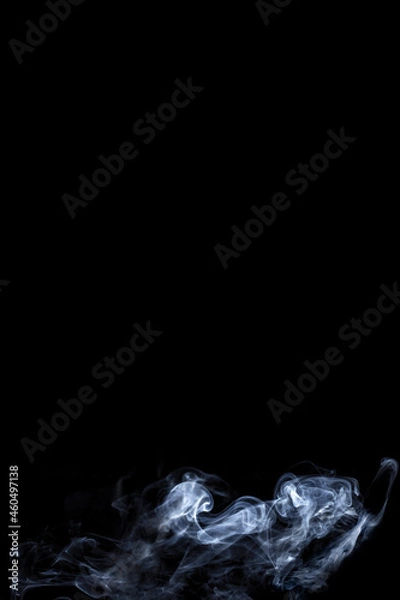 Obraz The smooth movement of white smoke on a black background, abstract things on a black background.