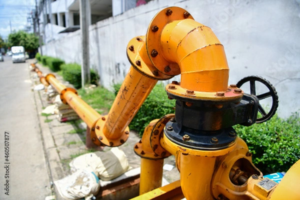 Obraz large water pump mounted on the drain pipe