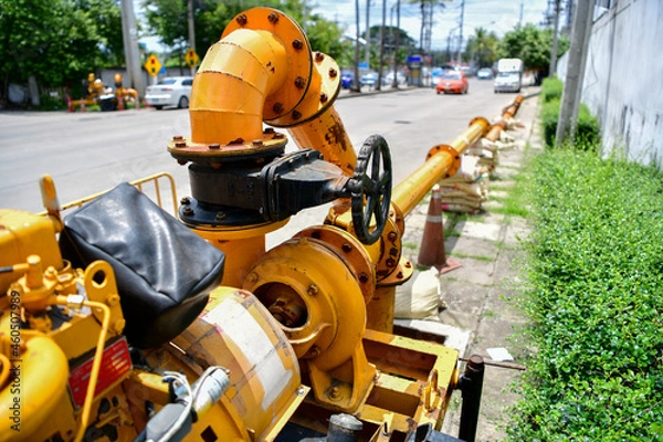 Obraz large water pump mounted on the drain pipe