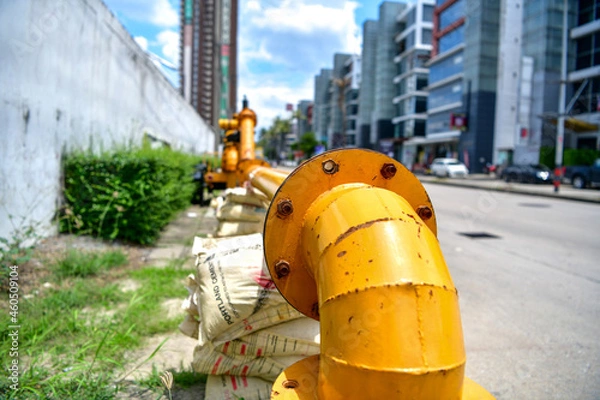 Obraz large water pump mounted on the drain pipe