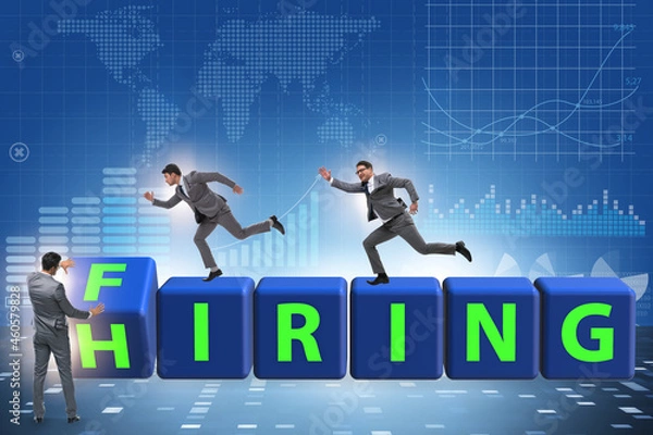 Fototapeta Hiring and firing concept with turning cubes