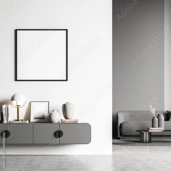 Fototapeta White and grey living room areas with empty square frame on wall