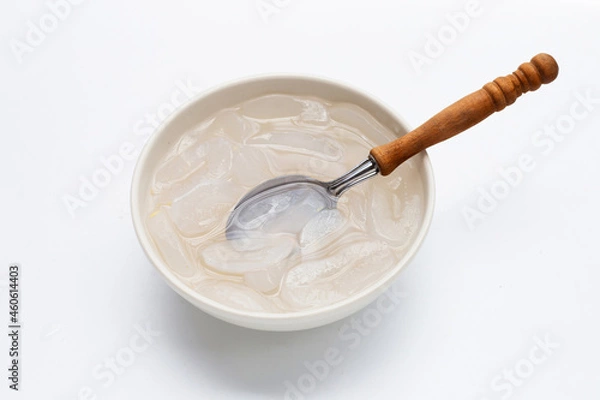 Fototapeta Bowl of sliced toddy palm in syrup on white background.