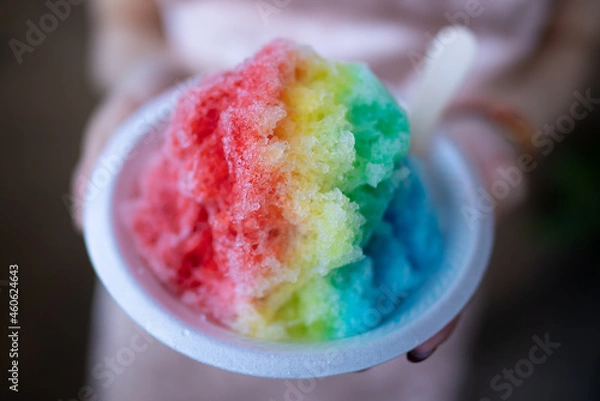 Obraz Rainbow shaved ice, Koko Marina Center, Honolulu, Oahu, Hawaii.  is an ice-based dessert made by shaving a block of ice and flavoring it with syrup and other sweet ingredients.