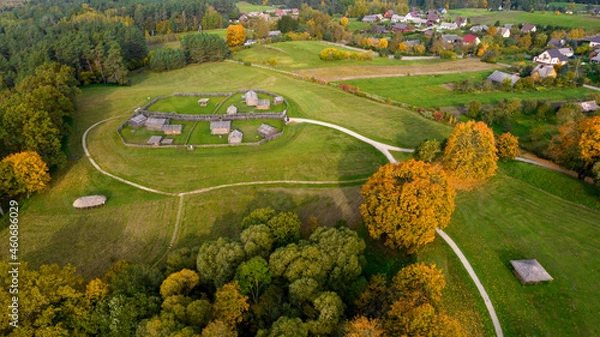 Fototapeta  Kernave in beautiful autumn colors photographed with a drone. Kernave was a medieval capital of the Grand Duchy of Lithuania and today is a tourist attraction and an archeological site. 
