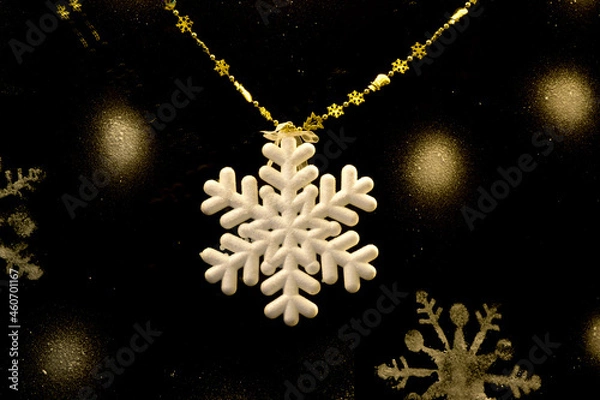 Obraz Christmas decorations. White snowflake on a black background.