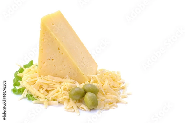 Fototapeta A piece of hard yellow cheese with olives in close-up, isolated on a white background